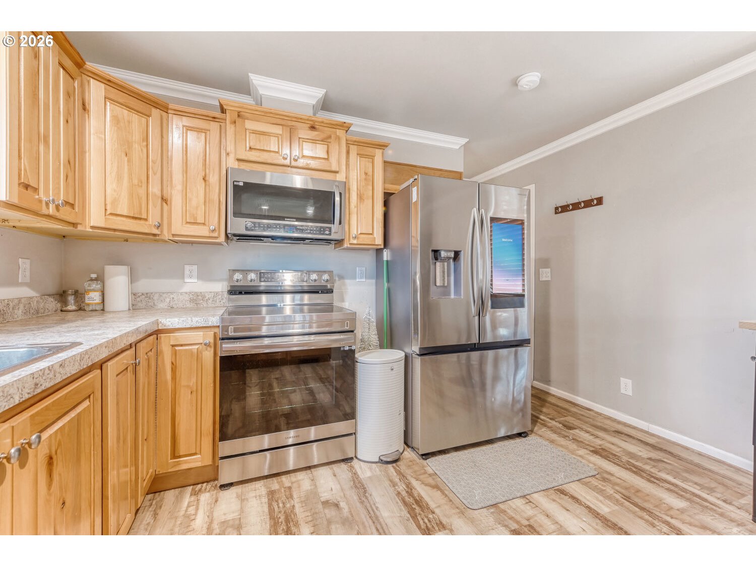 4264 Southeast 122nd Avenue, Unit 13 Portland, OR 97236 - Photo 14 of 30 a kitchen with granite countertop a refrigerator and a sink
