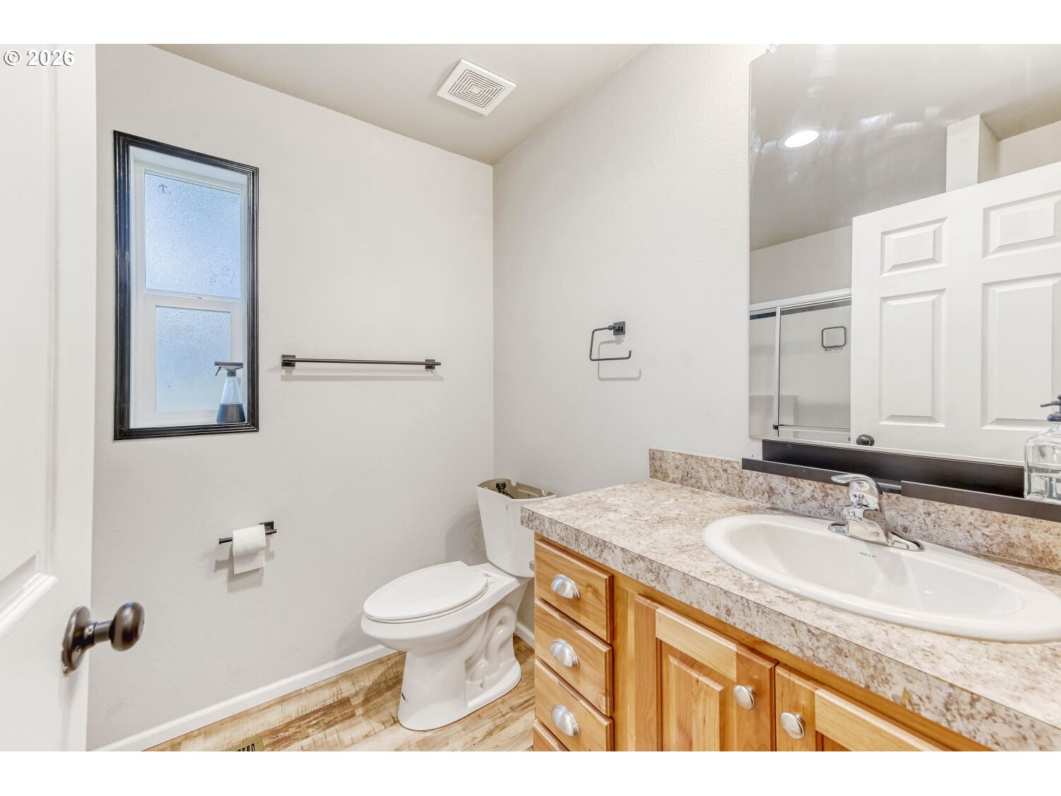 4264 Southeast 122nd Avenue, Unit 13 Portland, OR 97236 - Photo 18 of 30 a bathroom with a granite countertop sink toilet a large mirror and shower