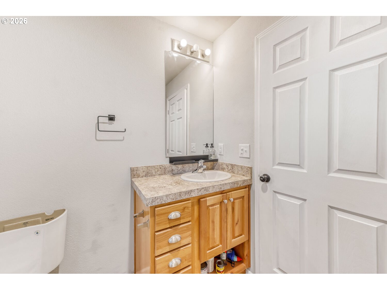 4264 Southeast 122nd Avenue, Unit 13 Portland, OR 97236 - Photo 19 of 30 a bathroom with a granite countertop sink and a mirror