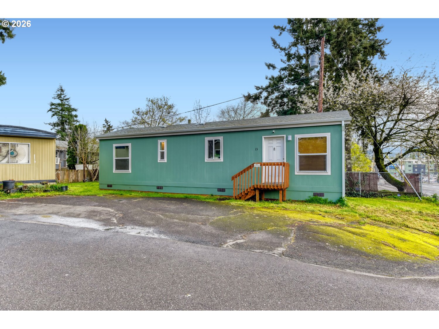4264 Southeast 122nd Avenue, Unit 13 Portland, OR 97236 - Photo 2 of 30 a view of outdoor space with yard and mountain view in back