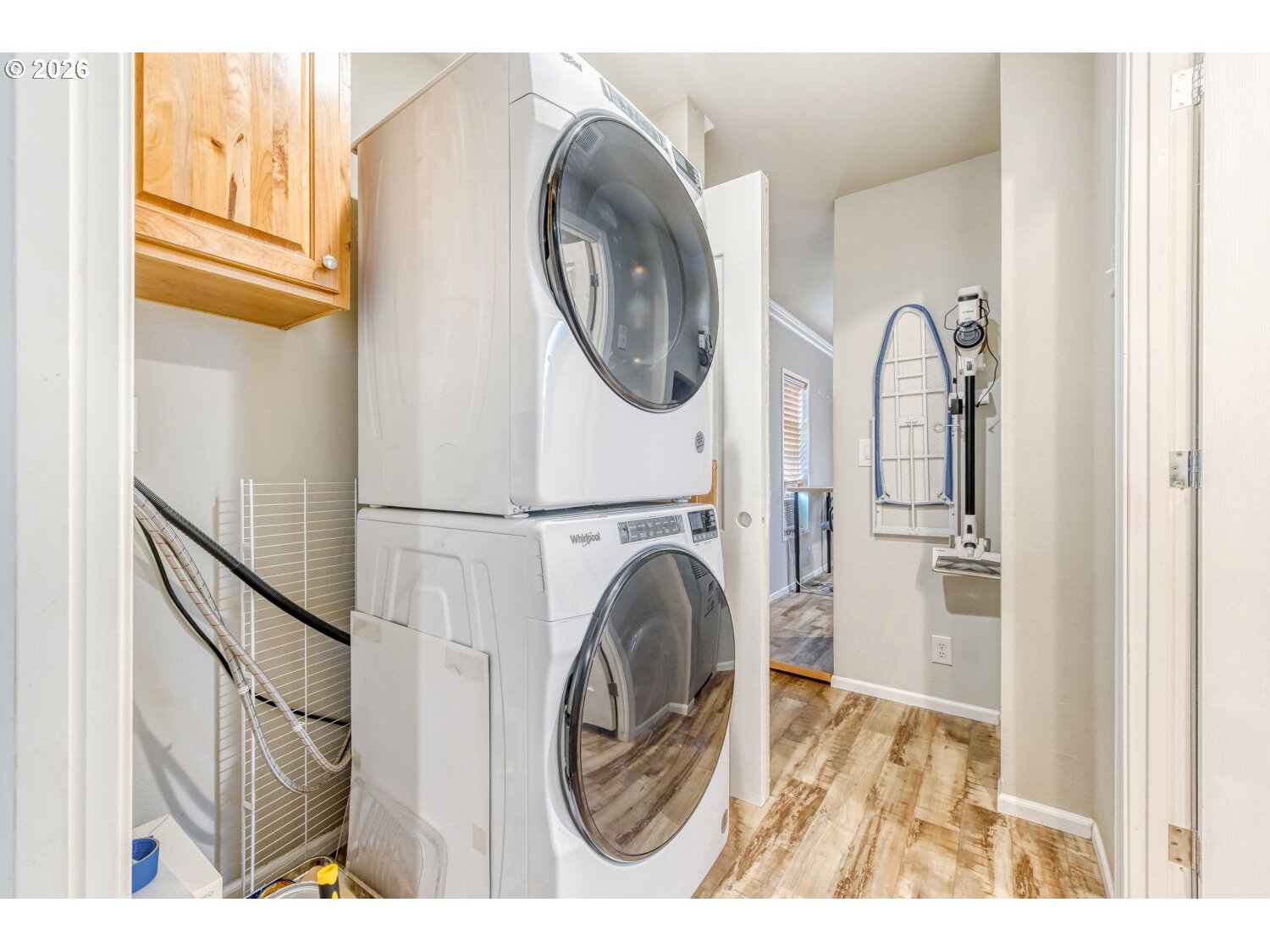 4264 Southeast 122nd Avenue, Unit 13 Portland, OR 97236 - Photo 21 of 30 a view of a hallway with washer and dryer