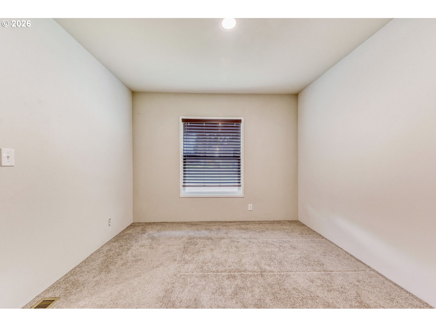 4264 Southeast 122nd Avenue, Unit 13 Portland, OR 97236 - Photo 26 of 30 a view of an empty room with a window