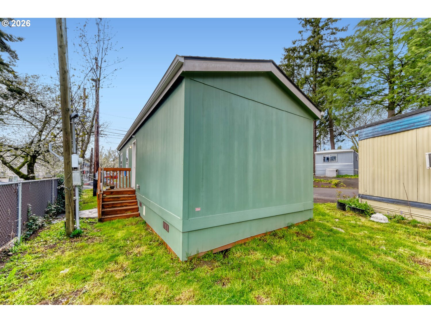 4264 Southeast 122nd Avenue, Unit 13 Portland, OR 97236 - Photo 28 of 30 a backyard of a house with lots of green space