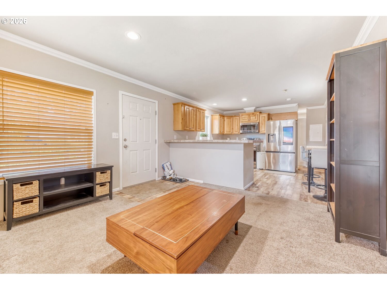 4264 Southeast 122nd Avenue, Unit 13 Portland, OR 97236 - Photo 6 of 30 a living room with stainless steel appliances kitchen island granite countertop furniture and a kitchen view