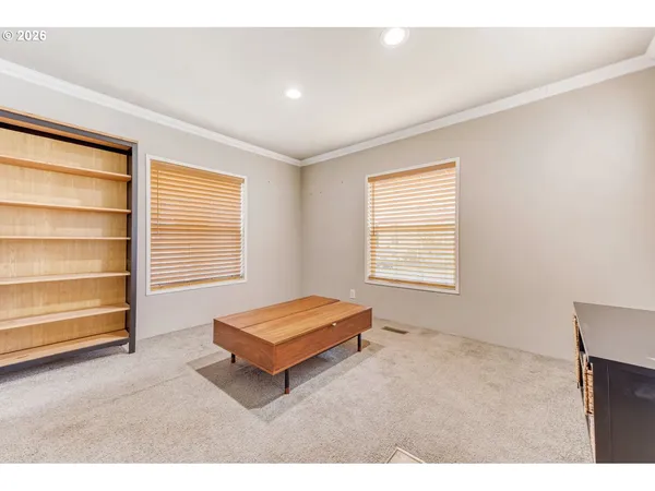 a living room with closet and window