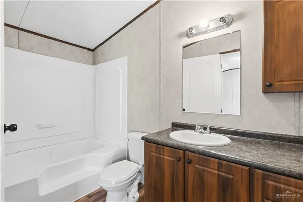 a bathroom with a sink a toilet and a bathtub