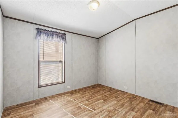 a view of room with window and ceiling fan