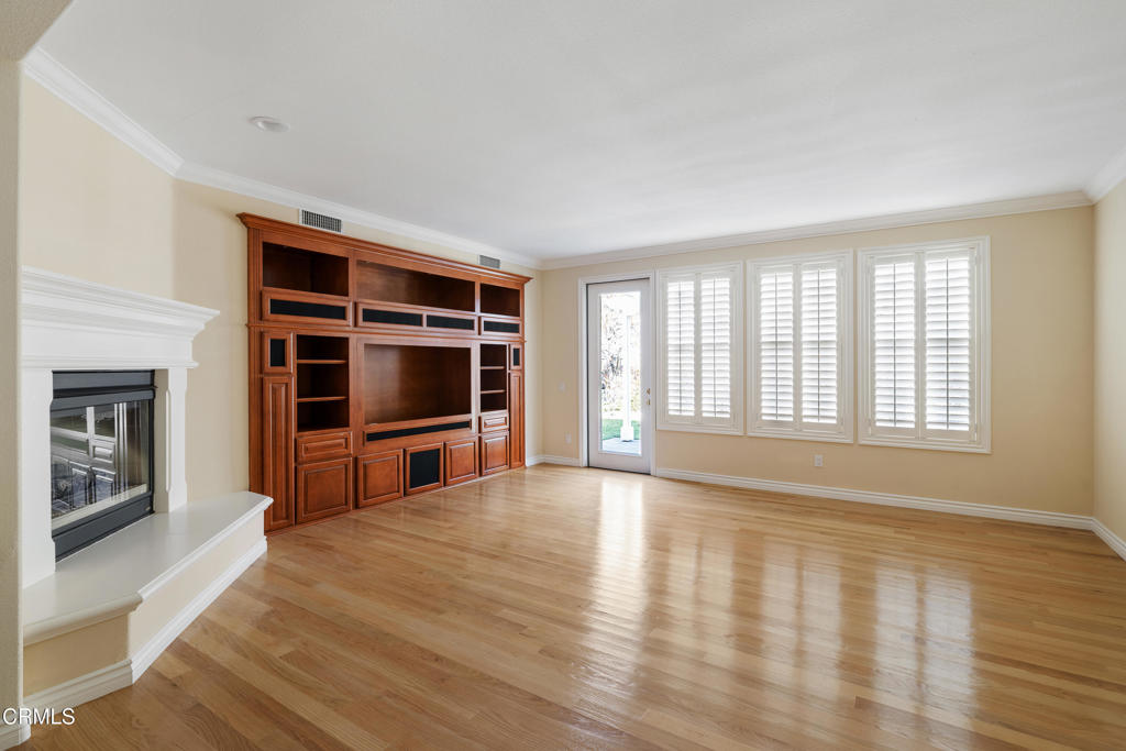 605 Coate Court Altadena, CA 91001 - Photo 14 of 49 a view of an empty room with a window and fire place