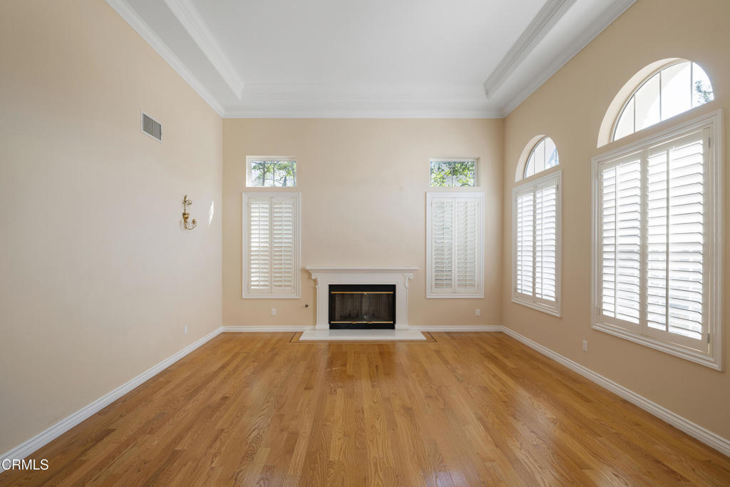 605 Coate Court Altadena, CA 91001 - Photo 6 of 49 an empty room with windows and fireplace