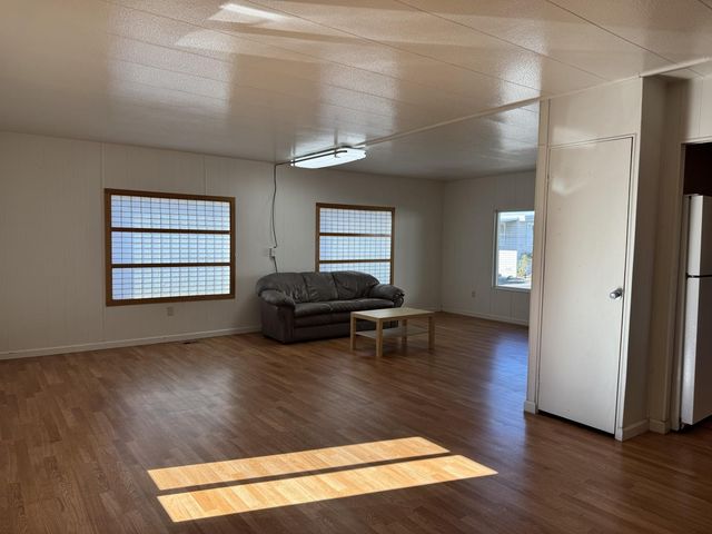 a view of livingroom with furniture and window