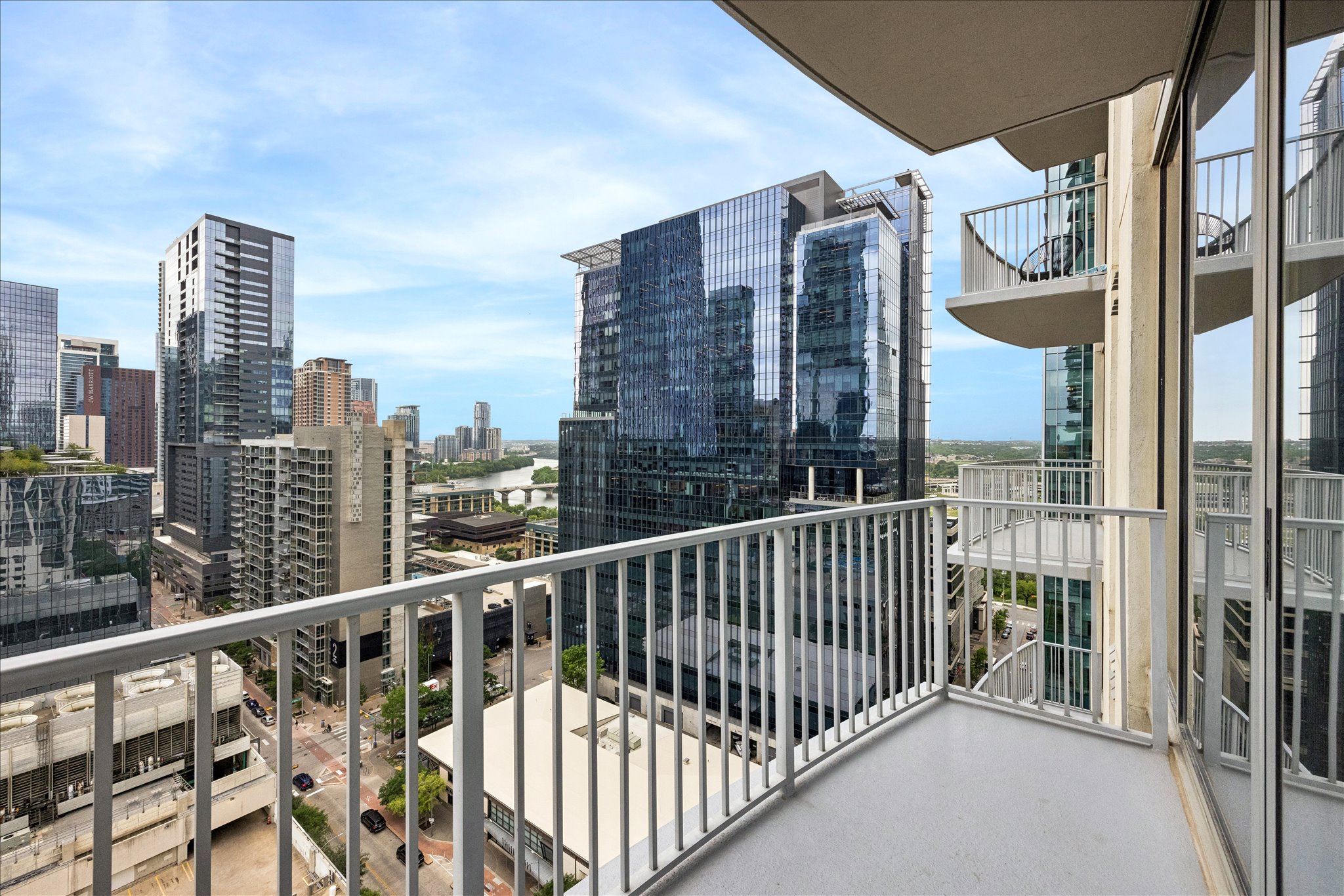 360 Nueces Street, Unit 2005 Austin, TX 78701 - Photo 17 of 35 The property features a balcony with metal railings and a cityscape view