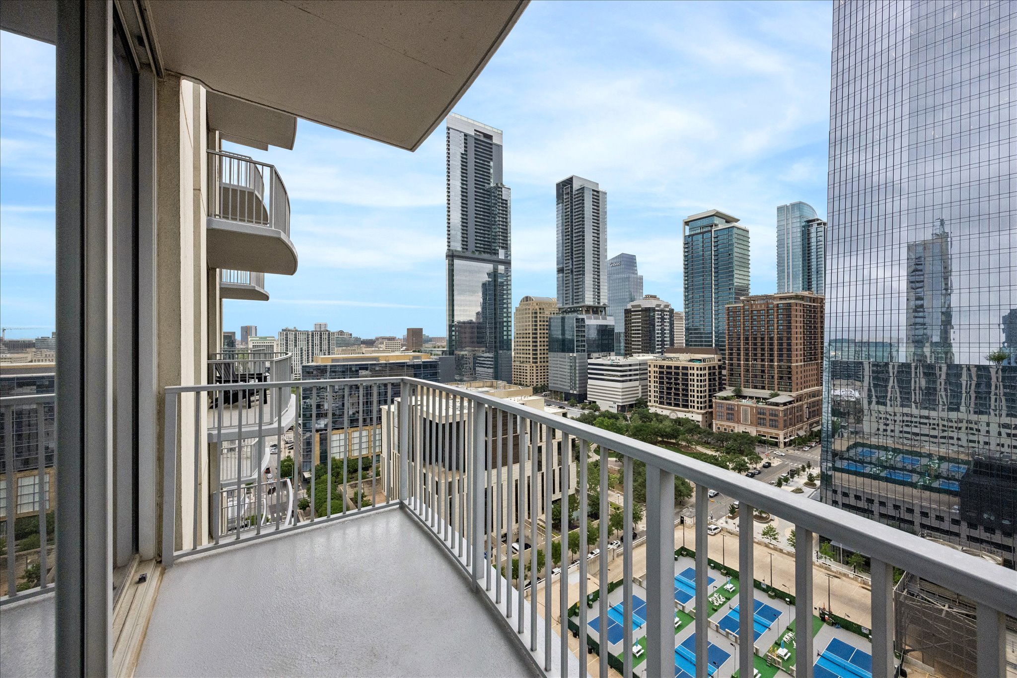360 Nueces Street, Unit 2005 Austin, TX 78701 - Photo 19 of 35 Balcony offering expansive city views, featuring a durable concrete floor and a sturdy metal railing