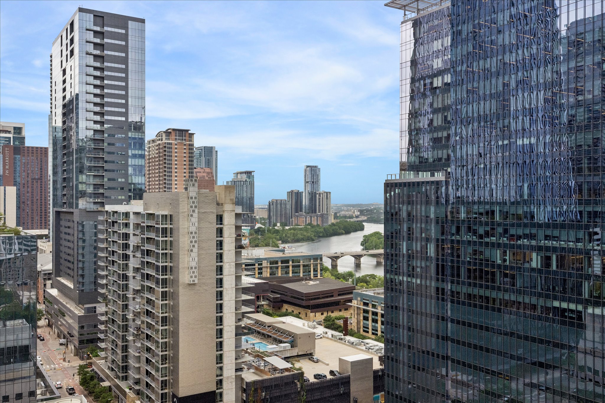 360 Nueces Street, Unit 2005 Austin, TX 78701 - Photo 20 of 35 Panoramic city views showcasing a river, bridge, and surrounding high-rise buildings