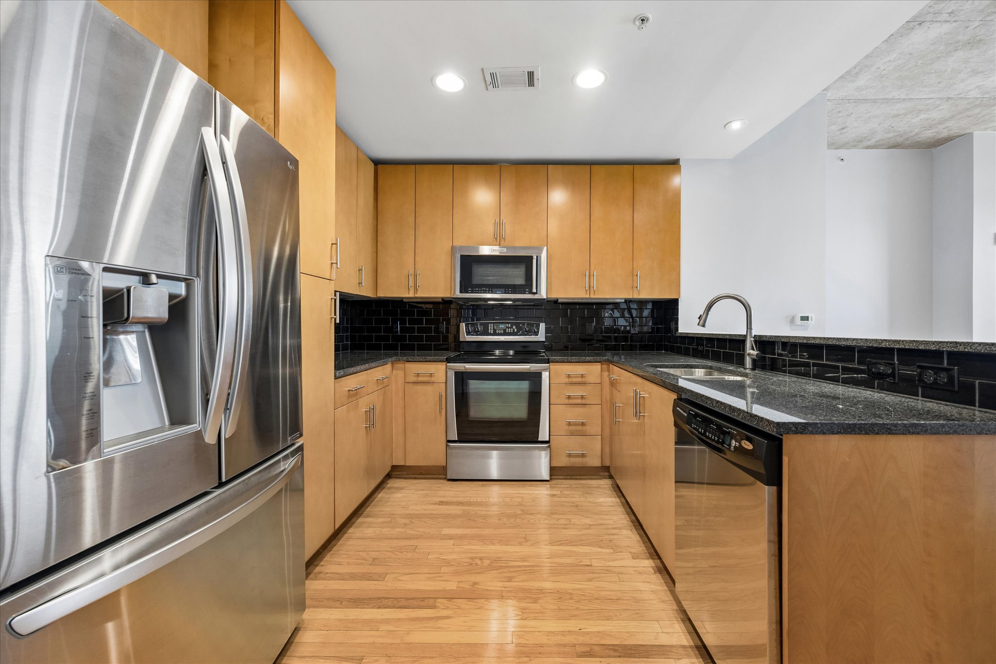 360 Nueces Street, Unit 2005 Austin, TX 78701 - Photo 2 of 35 Spacious kitchen with ample cabinets and stainless steel appliances.