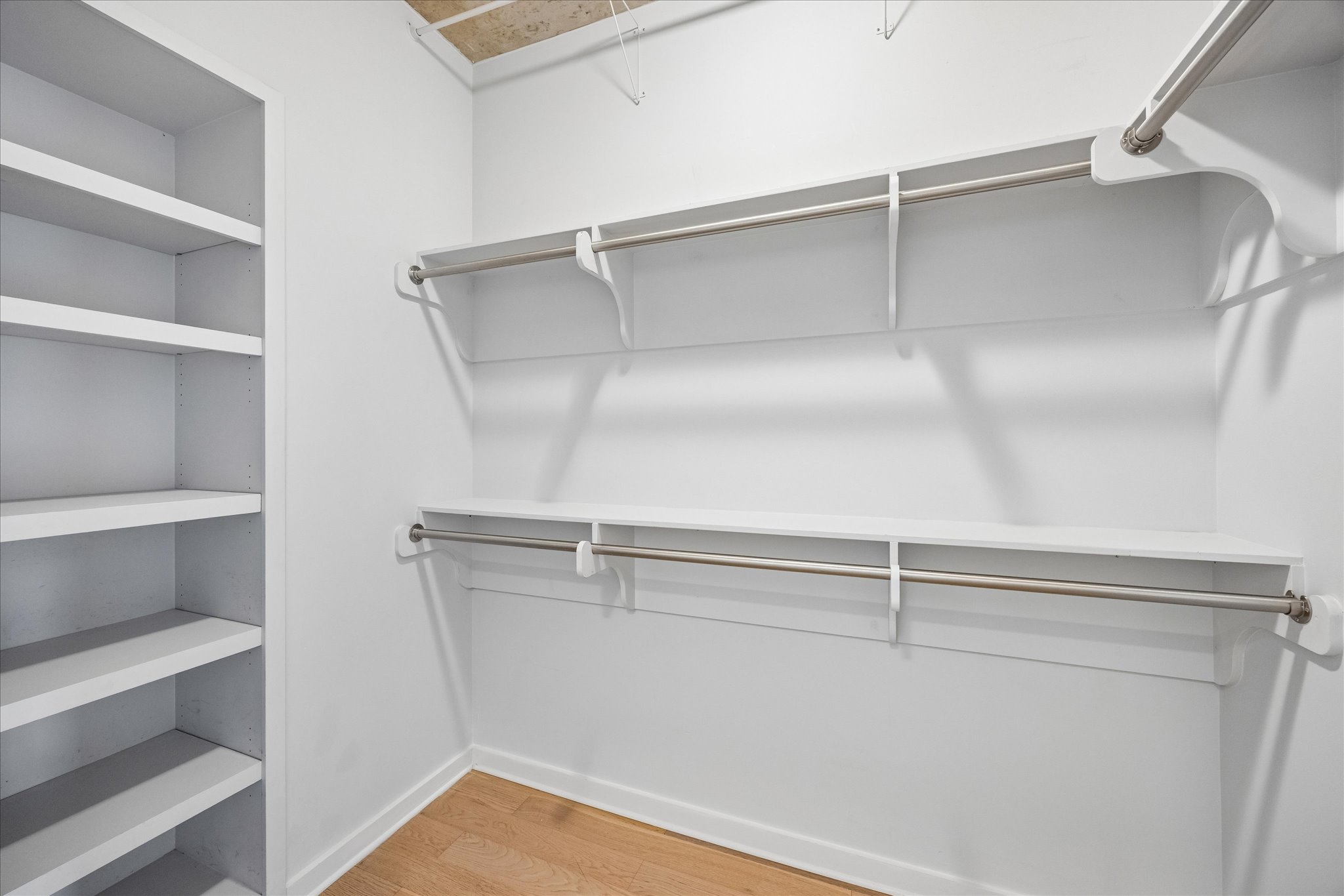 360 Nueces Street, Unit 2005 Austin, TX 78701 - Photo 9 of 35 Primary bedroom custom walk in closet.