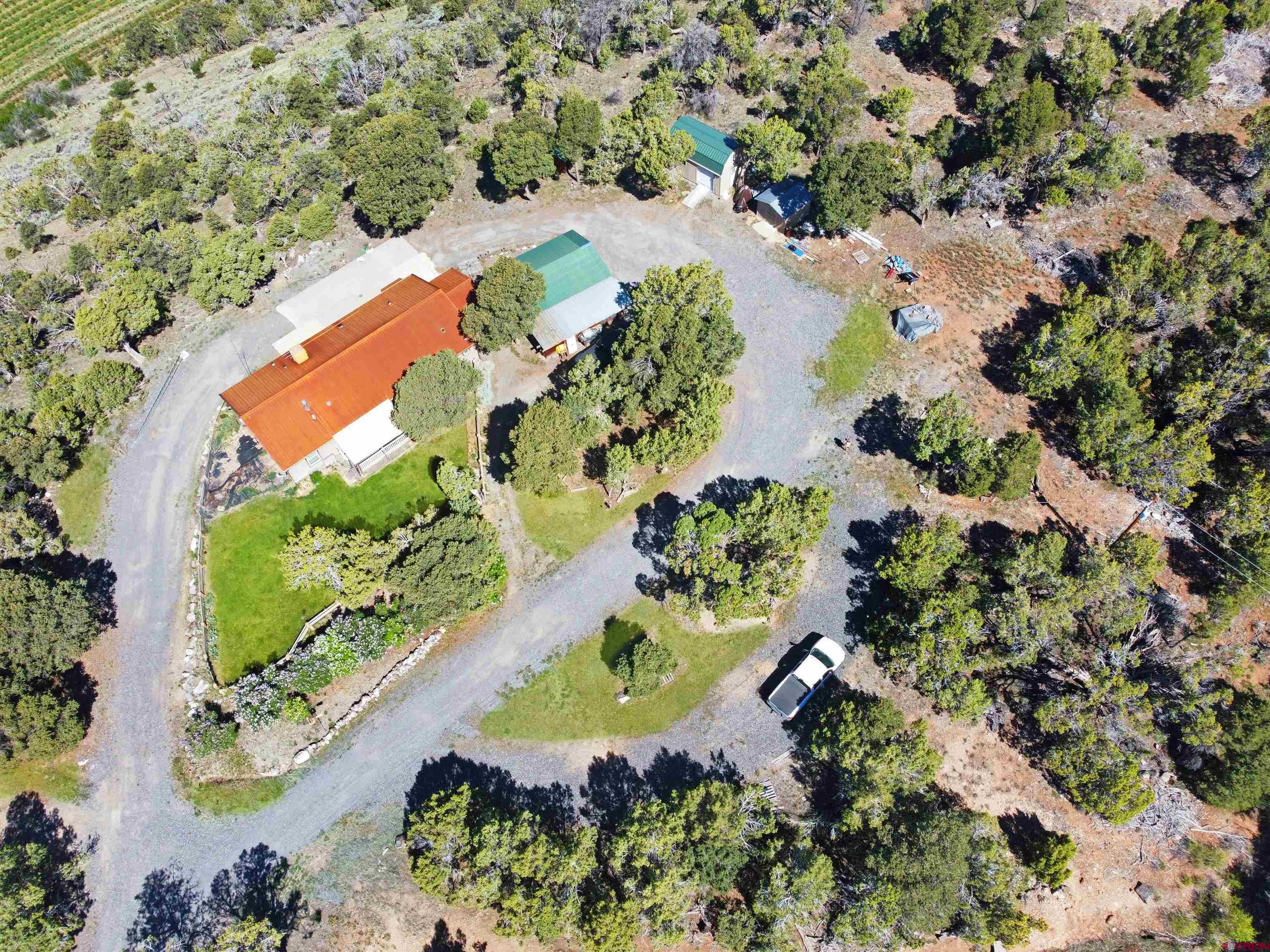 18311 2550th Road Cedaredge, CO 81413 - Photo 25 of 29 an aerial view of a house with a yard