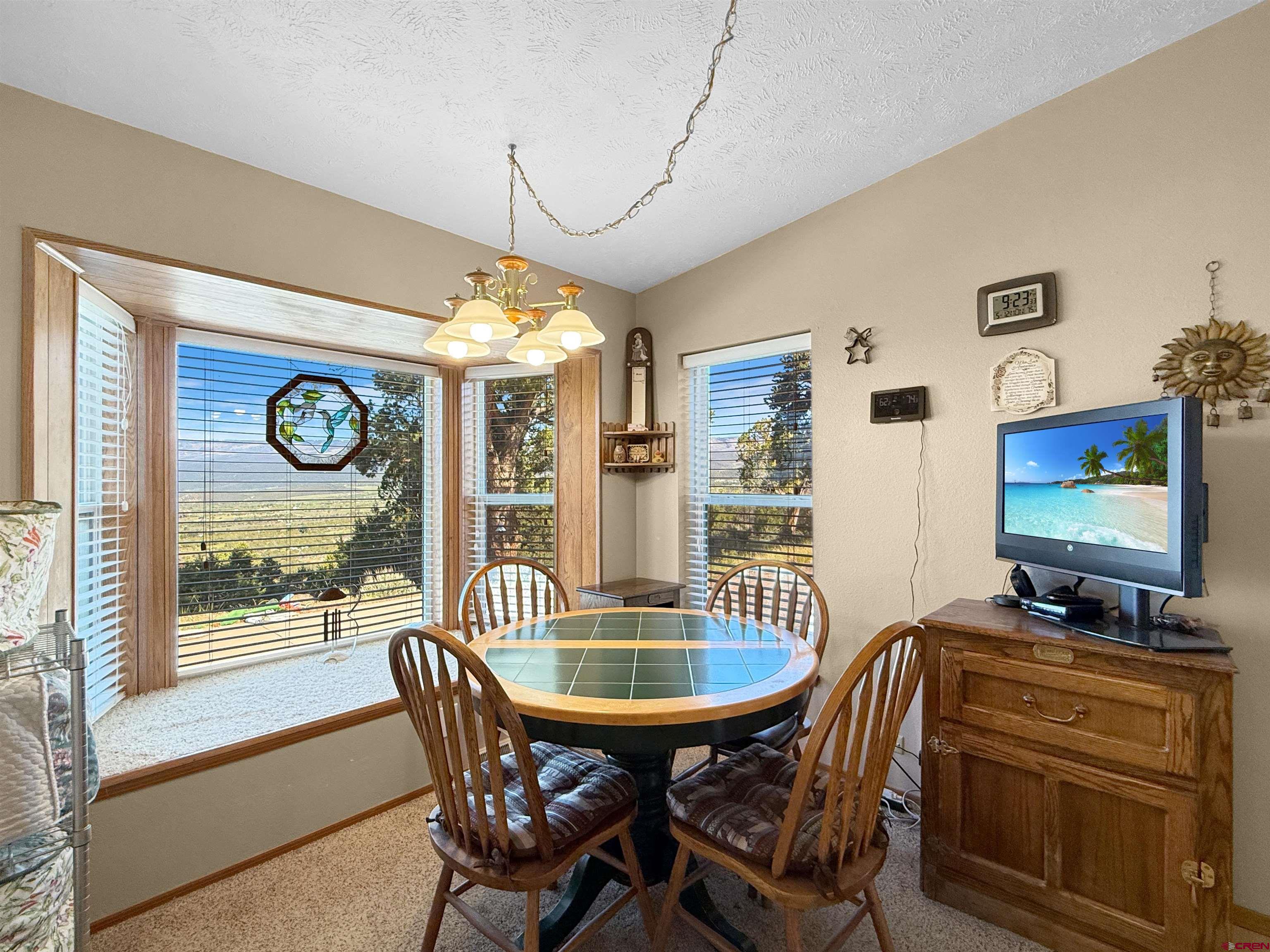 18311 2550th Road Cedaredge, CO 81413 - Photo 4 of 29 a dining room with furniture and window