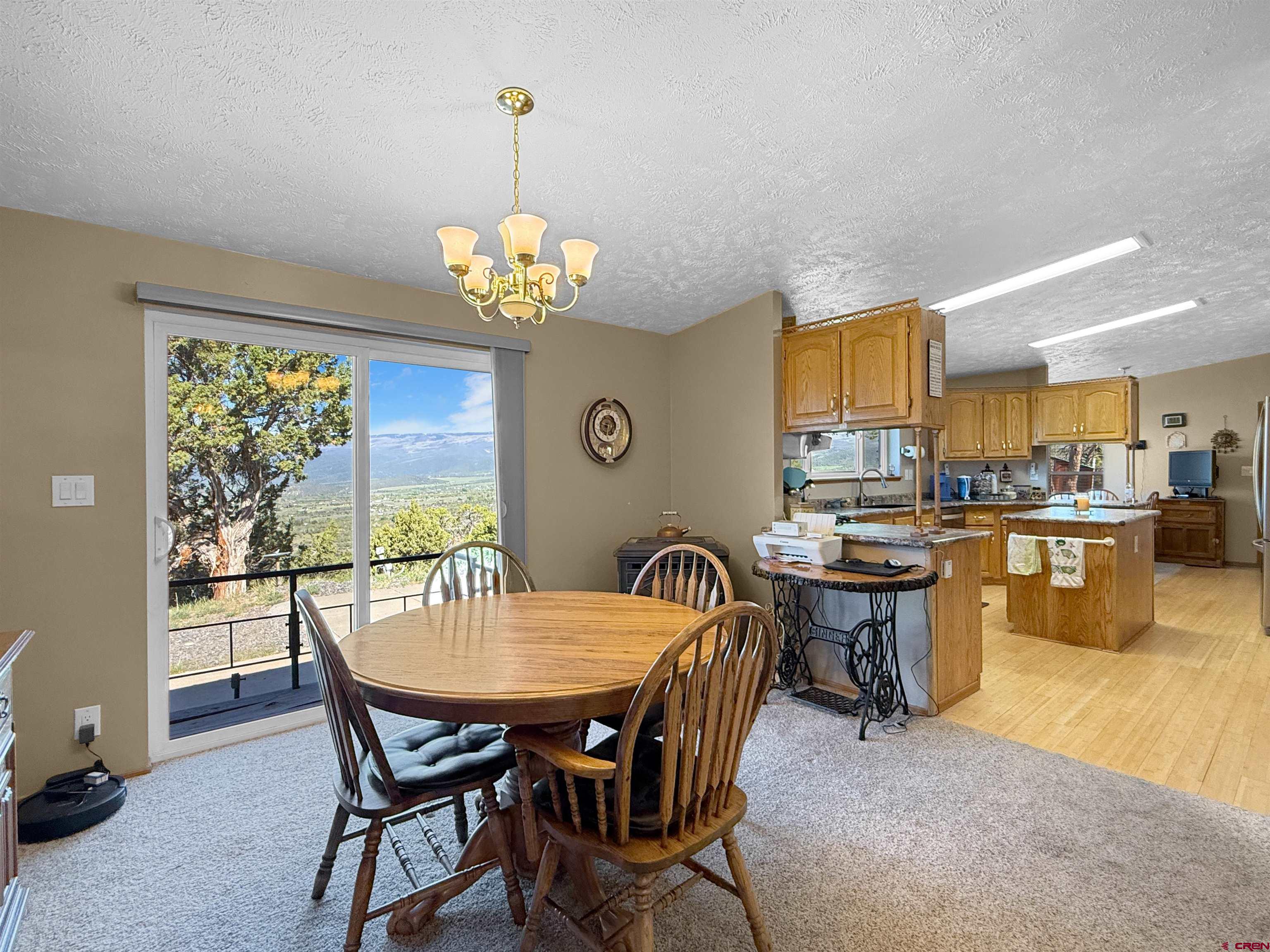 18311 2550th Road Cedaredge, CO 81413 - Photo 9 of 29 a view of a dining room with furniture window and outside view