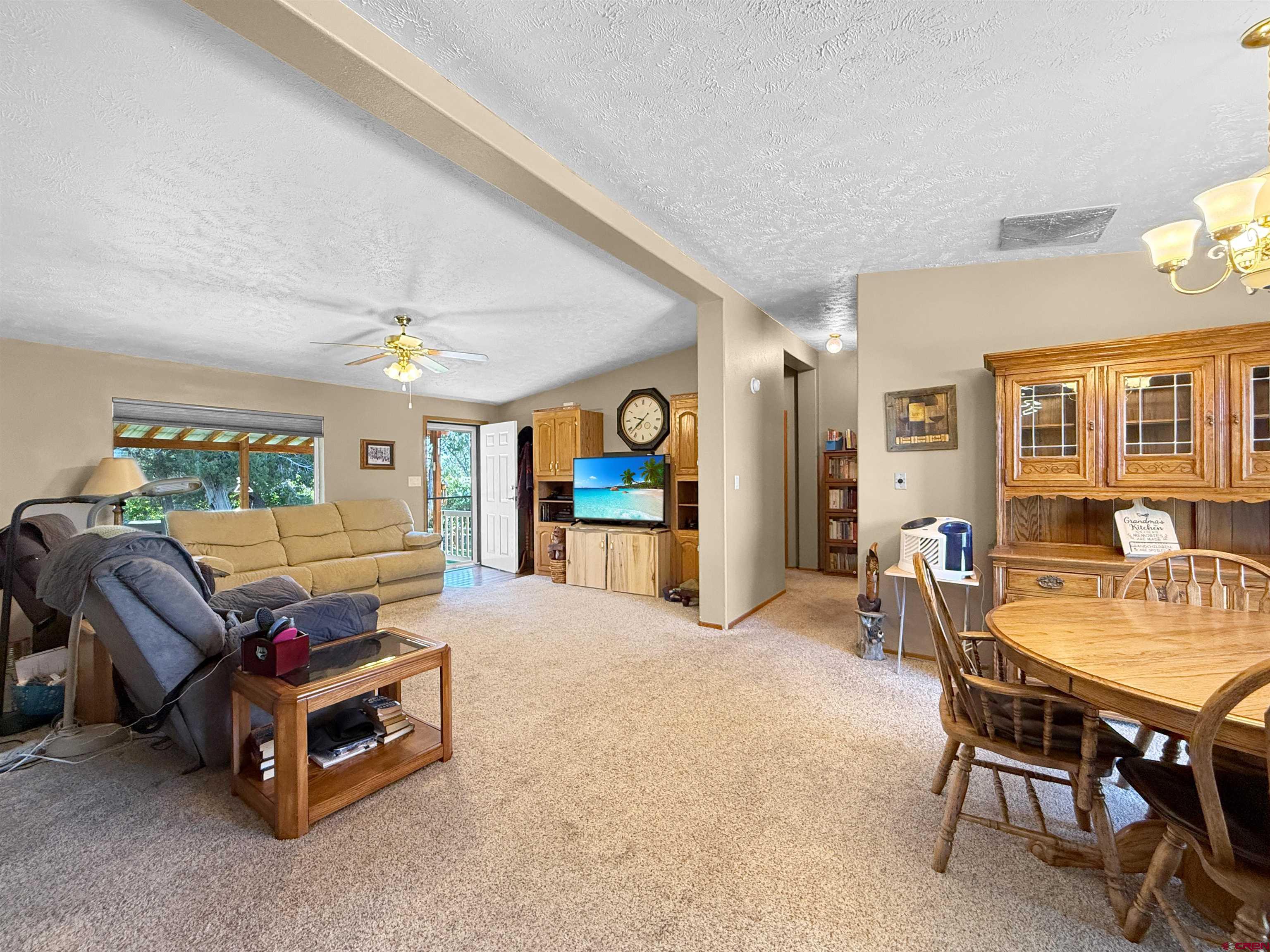 18311 2550th Road Cedaredge, CO 81413 - Photo 10 of 29 a living room with furniture and a table