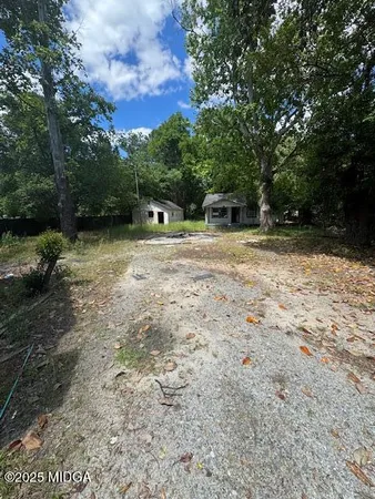 a backyard of a house with lots of green space