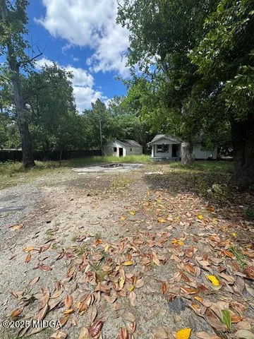 a backyard of a house with lots of green space