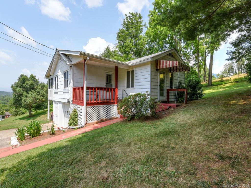 4607 Old Clyde Road Clyde, NC 28721 - Photo 1 of 24 a front view of house with yard and green space