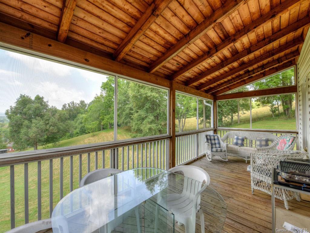 4607 Old Clyde Road Clyde, NC 28721 - Photo 15 of 24 a view of balcony with couch and wooden floor