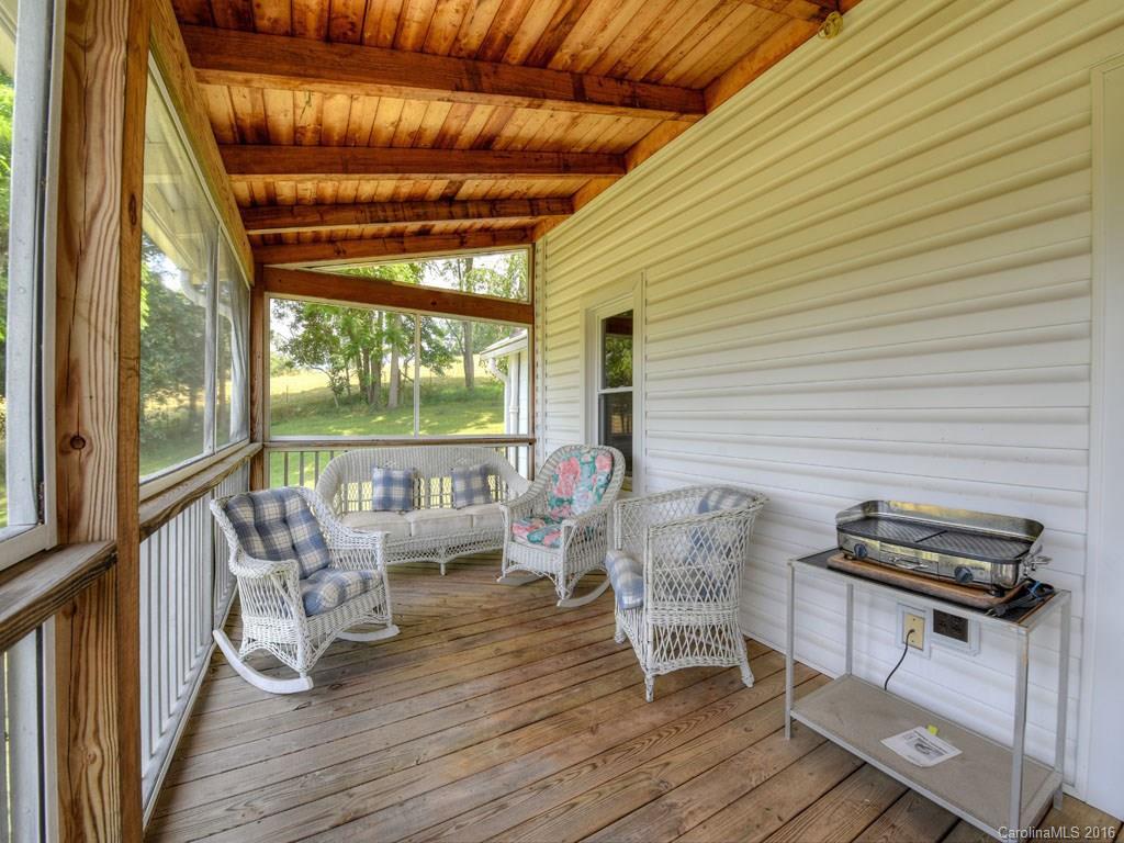 4607 Old Clyde Road Clyde, NC 28721 - Photo 17 of 24 a balcony with wooden floor outdoor seating and entryway