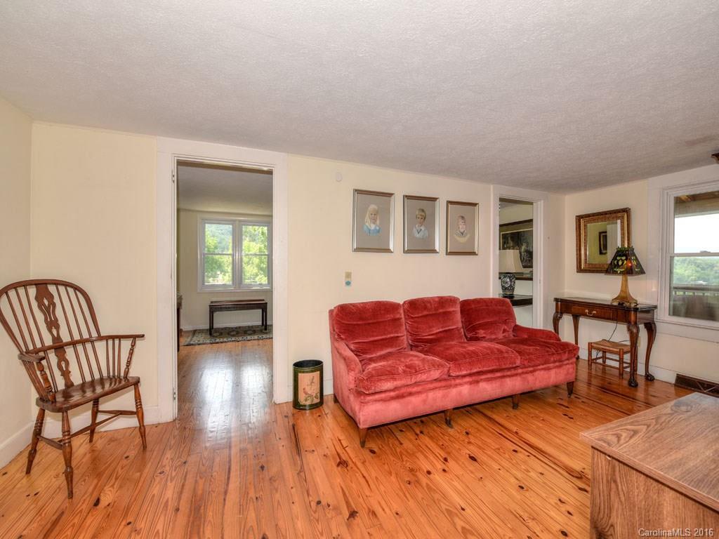 4607 Old Clyde Road Clyde, NC 28721 - Photo 3 of 24 a living room with furniture and a wooden floor