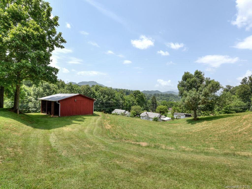4607 Old Clyde Road Clyde, NC 28721 - Photo 24 of 24 a view of yard with swimming pool and trees in the background