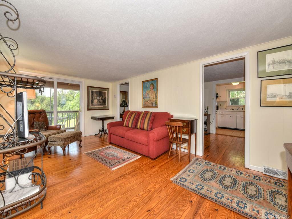 4607 Old Clyde Road Clyde, NC 28721 - Photo 7 of 24 a living room with furniture and a wooden floor