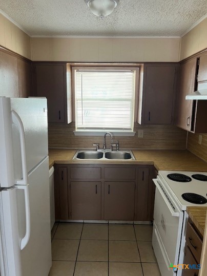 301 Liberty Street, Unit 208 Killeen, TX 76543 - Photo 5 of 8 a kitchen with a sink cabinets and stainless steel appliances
