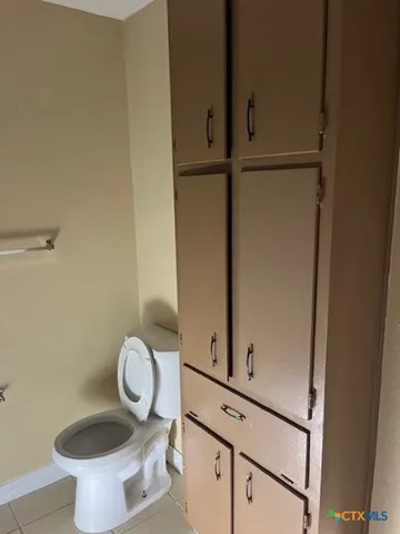 a bathroom with a toilet and a sink