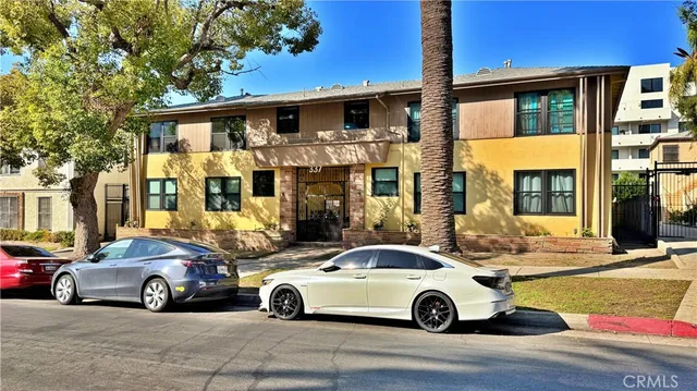 a view of a car parked in front of a house