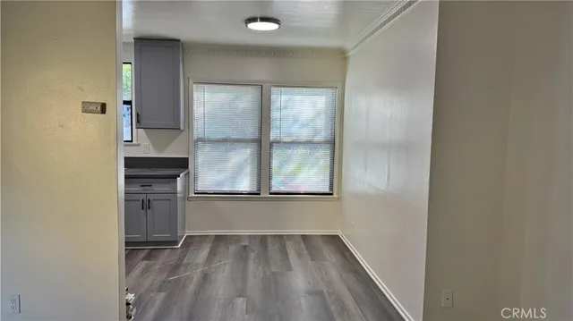 a view of a kitchen cabinets and a stove
