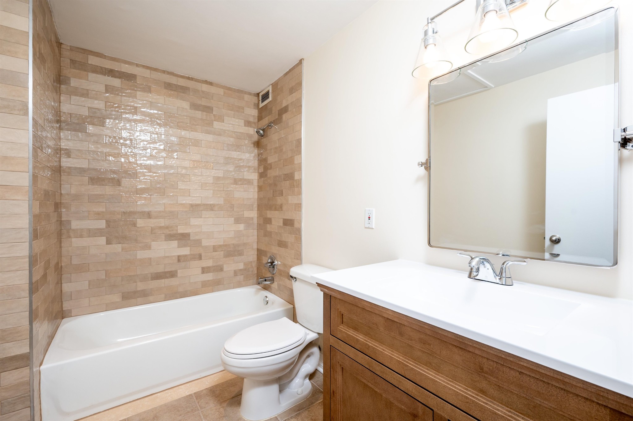 655 Riverside Drive, Unit 606A Memphis, TN 38103 - Photo 13 of 35 a bathroom with a sink a toilet a bathtub and shower