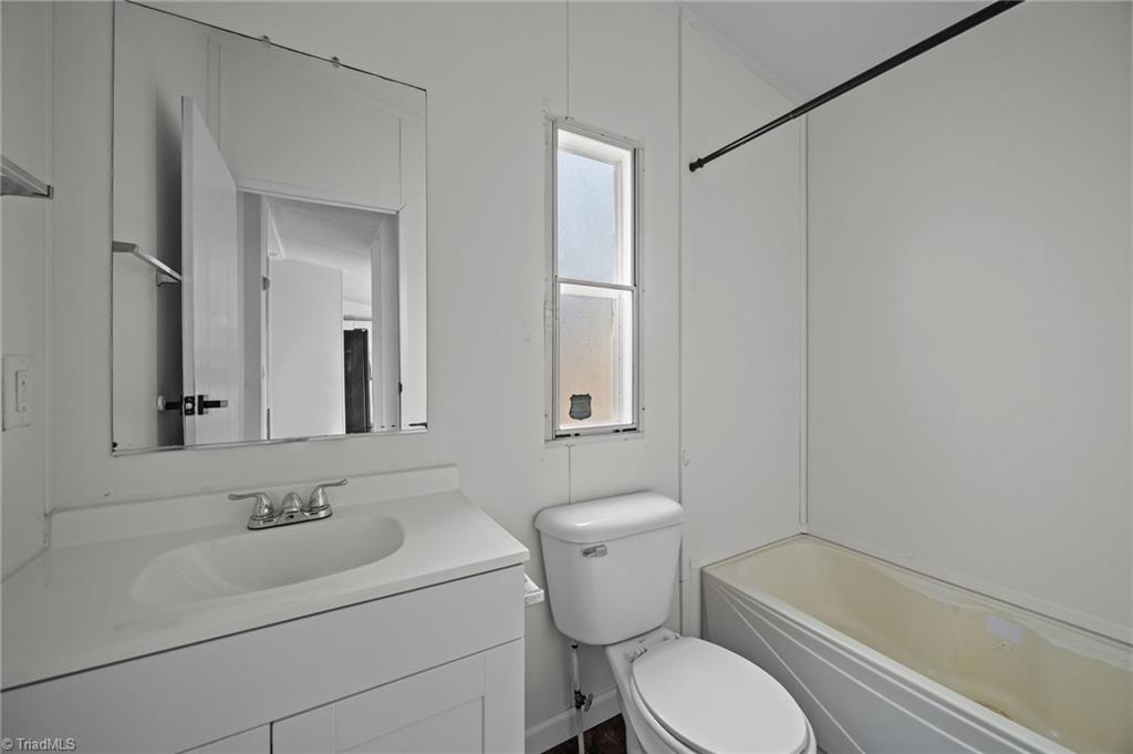 1360 Koonce Drive Trinity, NC 27370 - Photo 13 of 37 Separate full bathroom with single vanity and shower & tub combo.