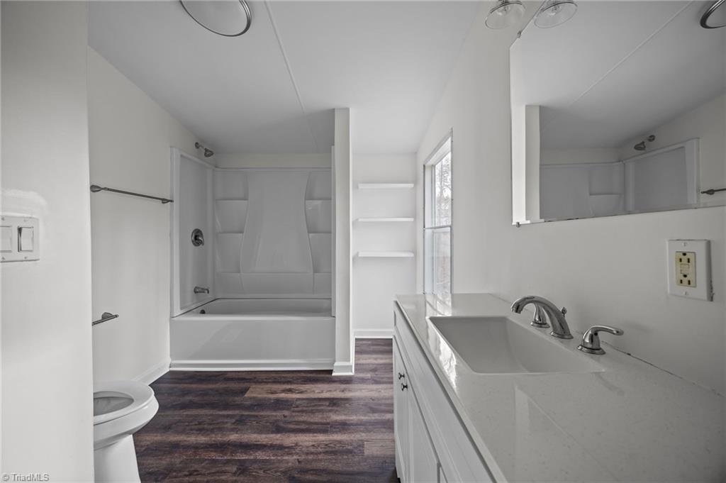 1360 Koonce Drive Trinity, NC 27370 - Photo 8 of 37 Primary bathroom with single vanity and shower & tub combo.