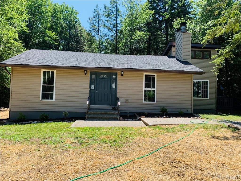 a house with yard in front of it