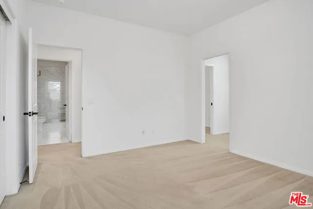 a bathroom with a double vanity sink toilet and a mirror
