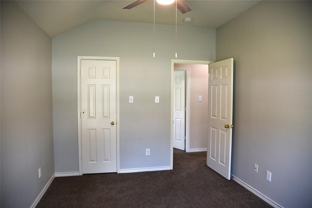 1526 Pebblestone Court Allen, TX 75002 - Photo 21 of 28 Carpeted room featuring a vaulted ceiling and a ceiling fan with integrated lighting