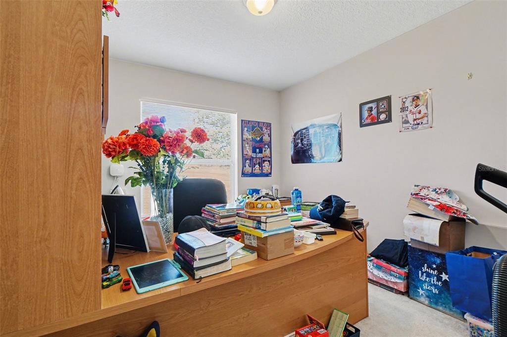 1670 East Spring Ridge Circle Winter Garden, FL 34787 - Photo 16 of 30 a work room with furniture and flowers