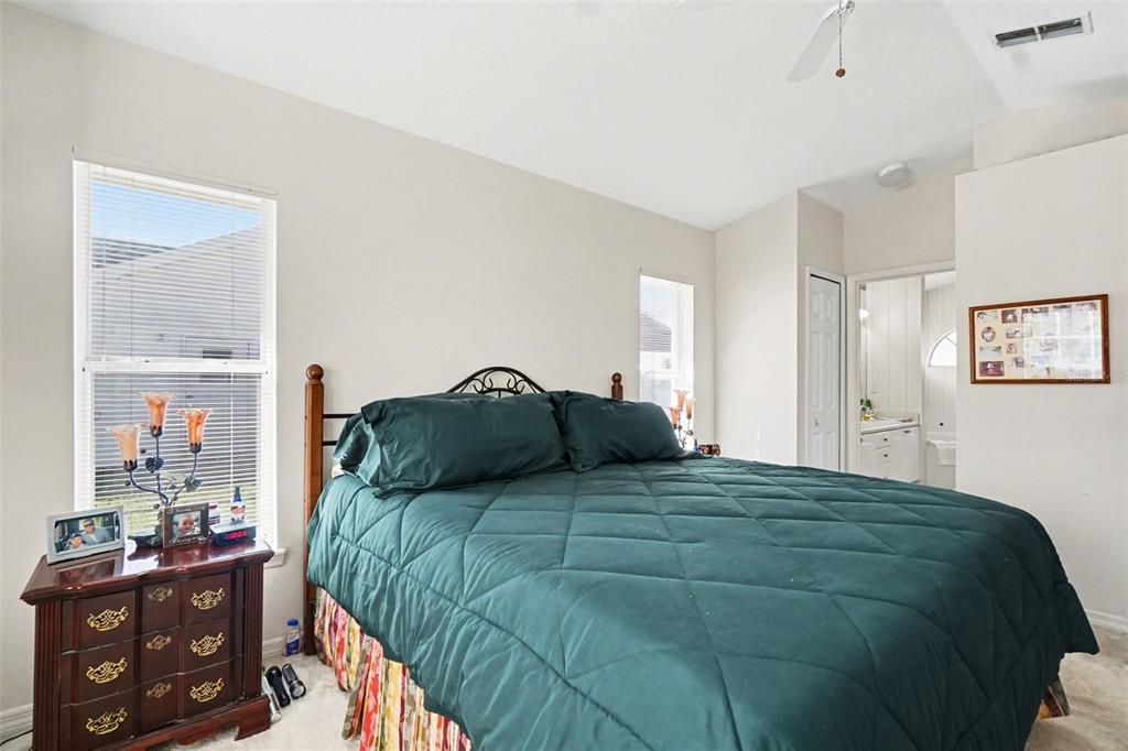 1670 East Spring Ridge Circle Winter Garden, FL 34787 - Photo 18 of 30 a bedroom with a bed and a closet