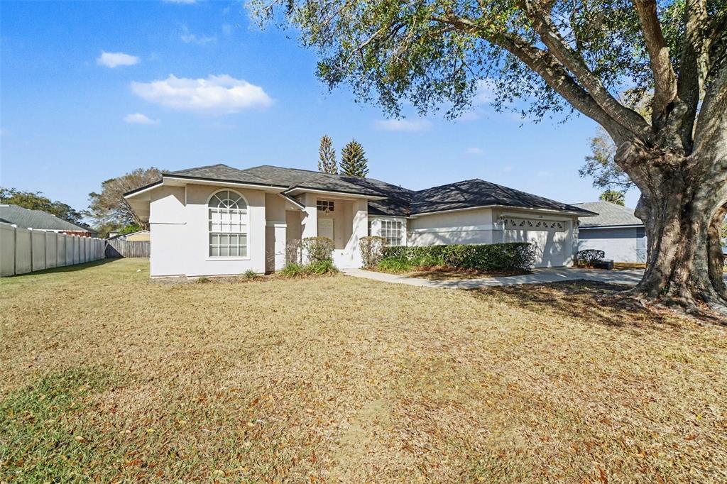 1670 East Spring Ridge Circle Winter Garden, FL 34787 - Photo 2 of 30 a front view of a house with a yard