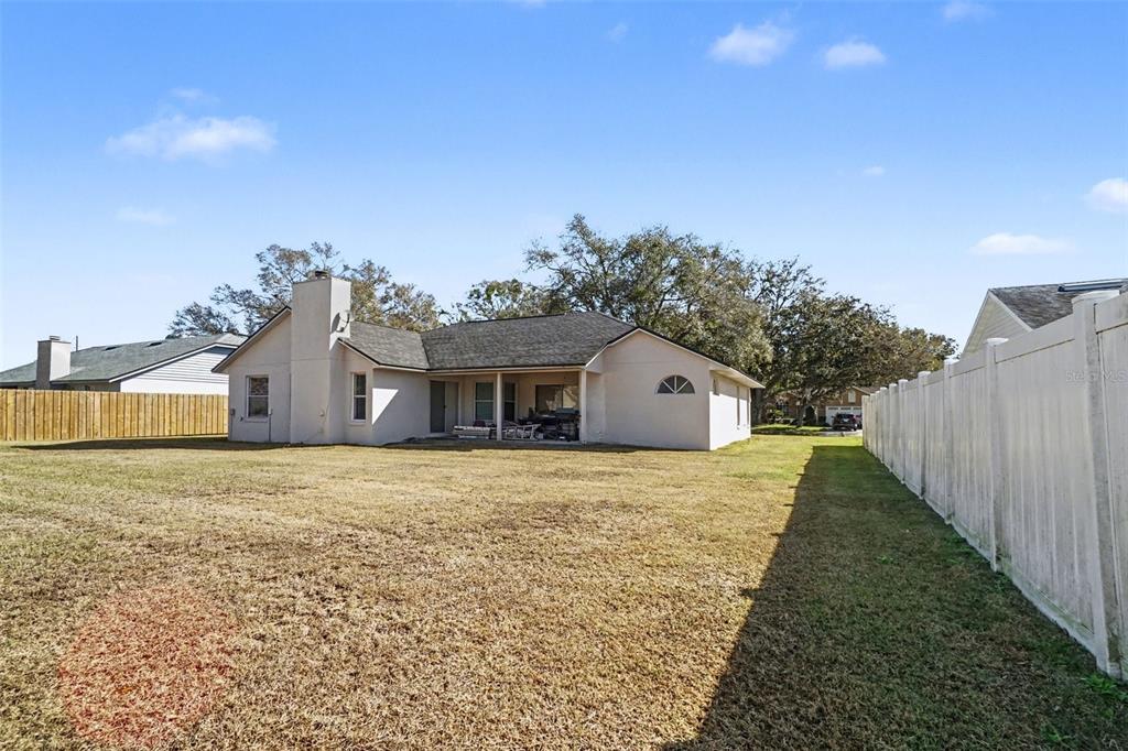 1670 East Spring Ridge Circle Winter Garden, FL 34787 - Photo 28 of 30 a front view of a house with a yard
