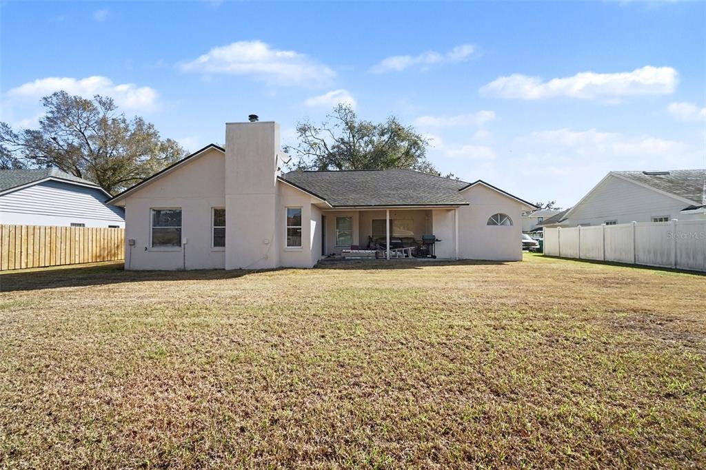 1670 East Spring Ridge Circle Winter Garden, FL 34787 - Photo 29 of 30 a front view of a house with a yard