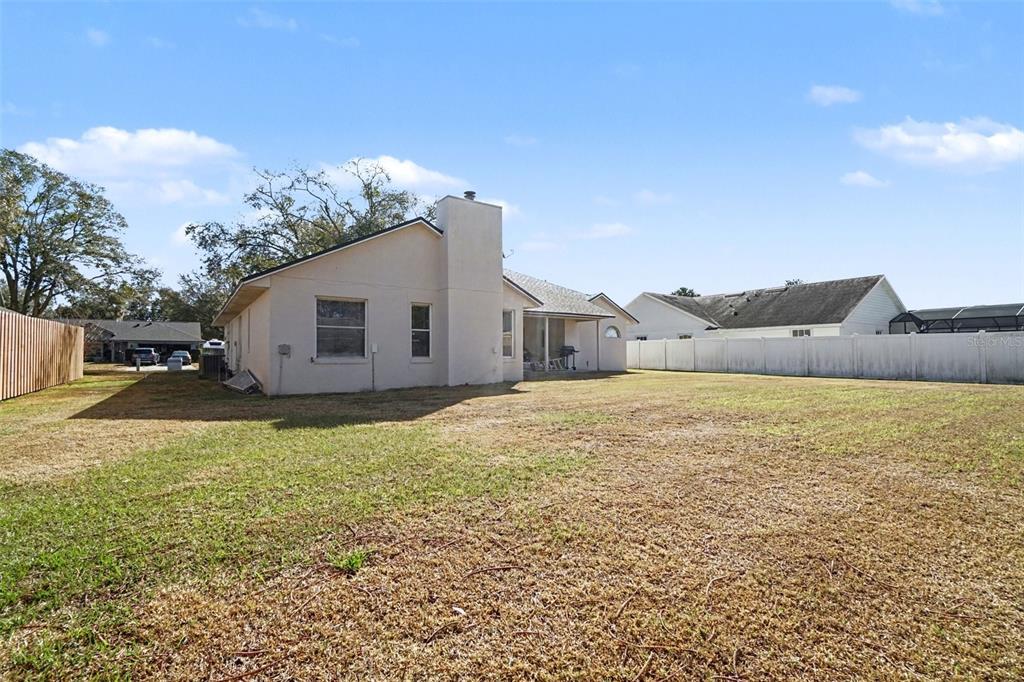 1670 East Spring Ridge Circle Winter Garden, FL 34787 - Photo 30 of 30 a bathroom with a sink and a yard