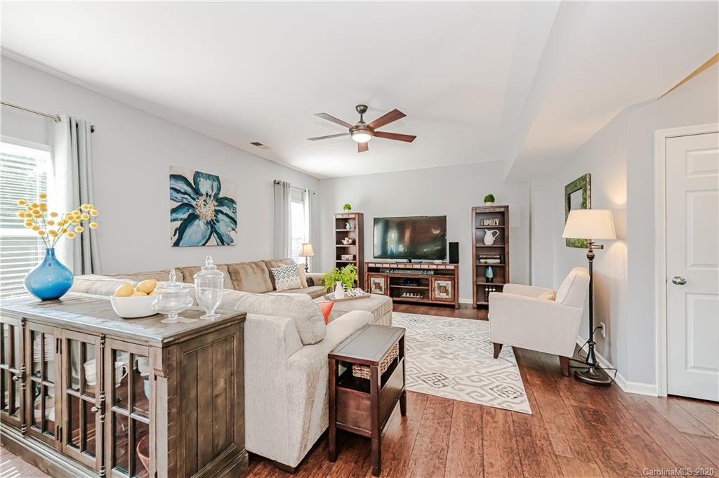 640 Alsace Lane Fort Mill, SC 29708 - Photo 17 of 36 a living room with furniture a flat screen tv and a table