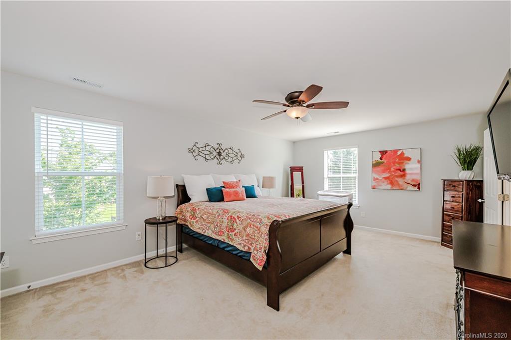 640 Alsace Lane Fort Mill, SC 29708 - Photo 20 of 36 a bedroom with a bed and a flat screen tv on the dresser