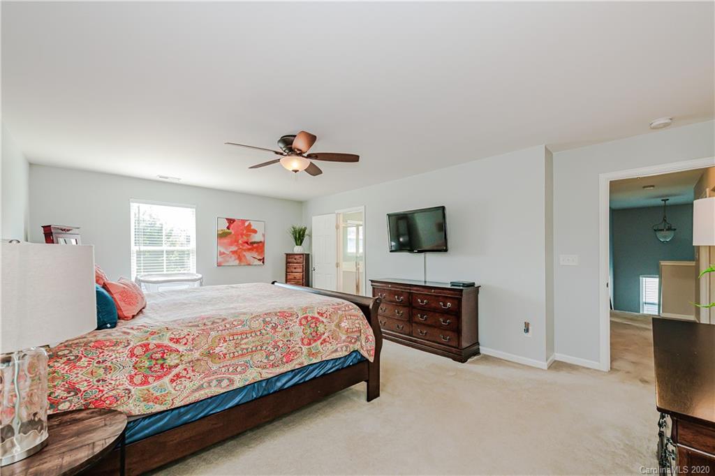 640 Alsace Lane Fort Mill, SC 29708 - Photo 21 of 36 a bedroom with a bed and a couch